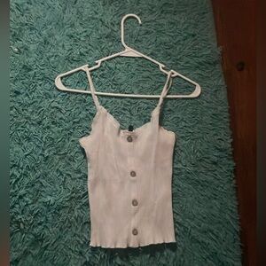 A white top, it’s Derek Heart,and it’s a size large